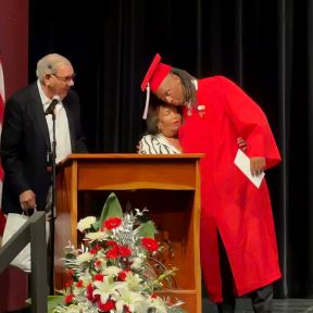 Mr. Leesfield presents the 2026 Dexter Butler College Scholarship to Key West High School Senior James Osborne as he embraces Anita Butler, Dexter's mother